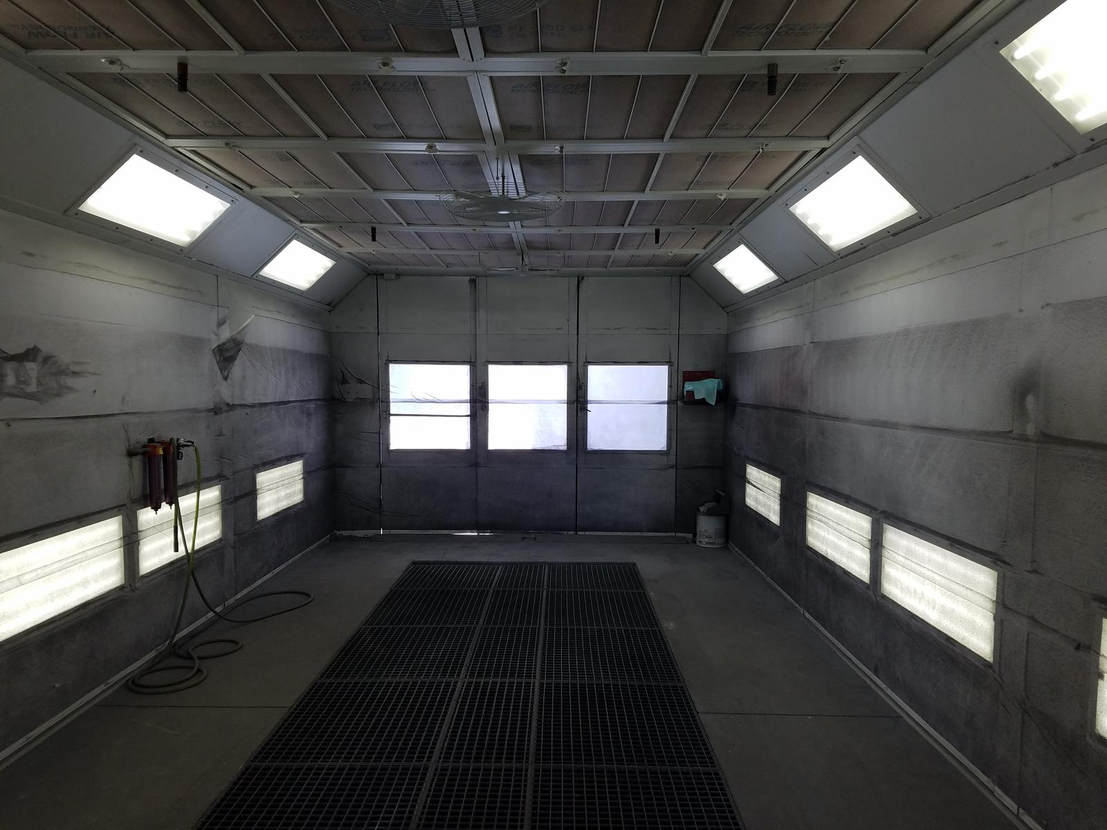 Home v4 1 Paint booth interior with overspray buildup on the walls and ceiling filters